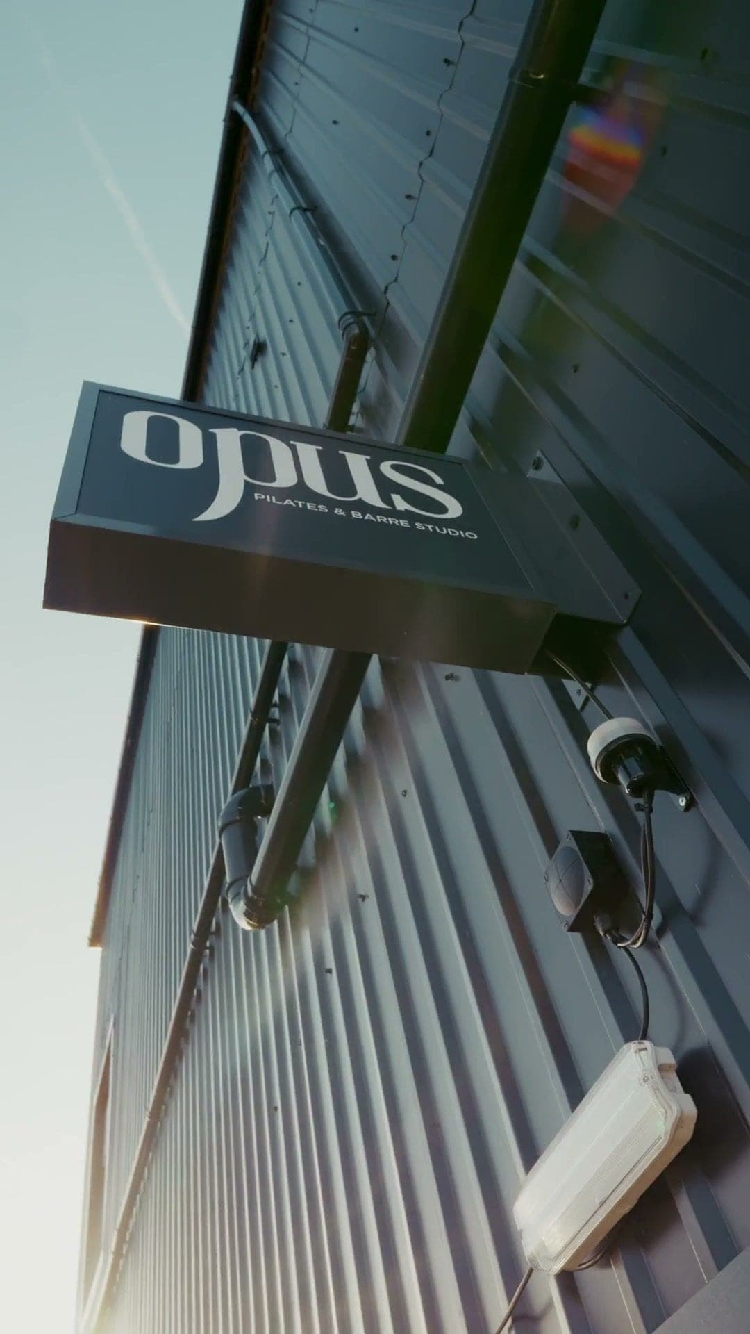 The opus sign on the outside of the building at Bridge Court